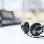 Headset headphones telephone on desk in call center